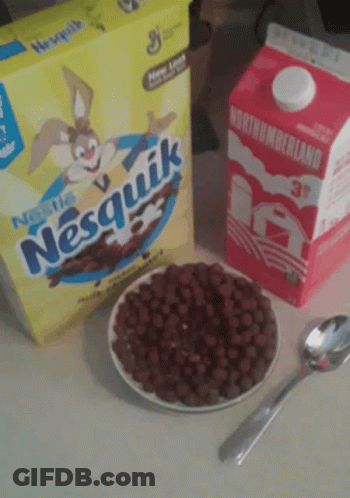 A Box Of Nesquik Cereal Sits Next To A Carton Of Northumberland Milk GIF