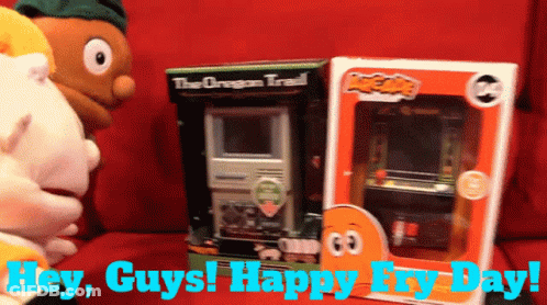 A Box Of The Oregon Trail Sits Next To A Box Of Arcade Games GIF