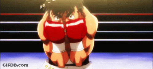 A Boxer Is Kneeling Down In A Boxing Ring With His Hands On His Face . GIF