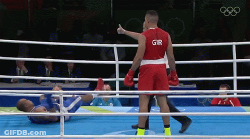 A Boxer Wearing A Red Shirt With The Letter G On It GIF