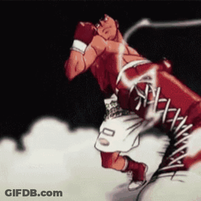 A Boxer With The Number 00 On His Shorts Is Throwing A Punch GIF