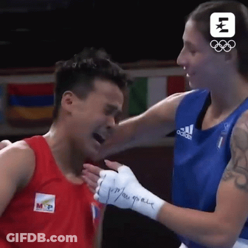 A Boxing Match Between A Man And A Woman With A Logo For The Olympics GIF