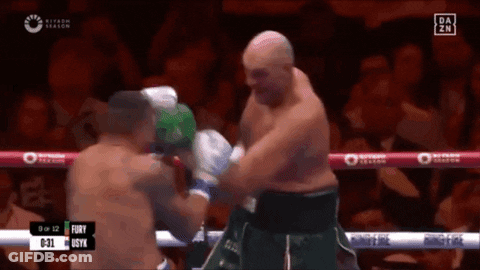 A Boxing Match Between Fury And Syx Is Being Shown GIF