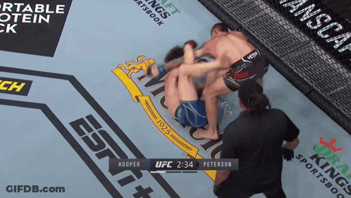 A Boxing Match Between Hooper And Peterson Is Being Broadcast On Espn GIF