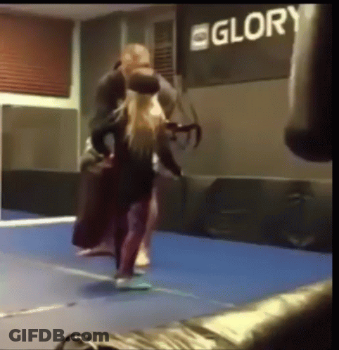 A Boxing Ring With A Sign That Says Glory In The Background GIF