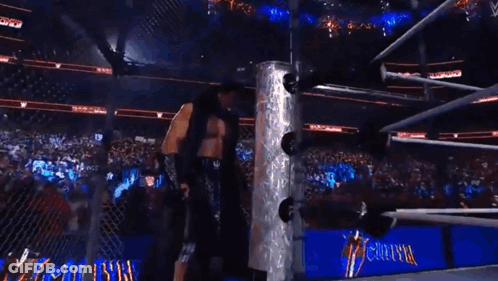 A Boxing Ring With A Sign That Says Otvk On It GIF