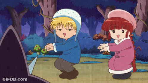 A Boy And A Girl Are Dancing In A Cartoon GIF