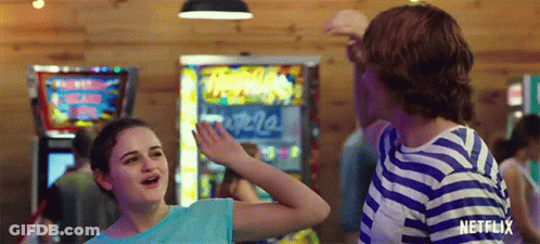 A Boy And A Girl Are Dancing In A Room With A Netflix Logo On The Bottom GIF