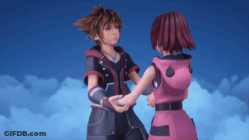 A Boy And A Girl Are Holding Hands And Looking At Each Other GIF