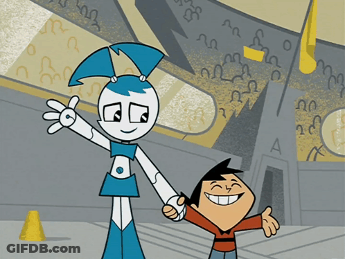 A Boy And A Girl Are Holding Hands In Front Of A Building With A Letter A On It GIF