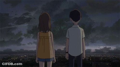 A Boy And A Girl Are Holding Hands In Front Of A City GIF