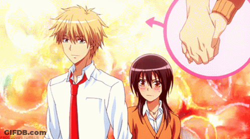 A Boy And A Girl Are Holding Hands With A Pink Circle In The Background GIF