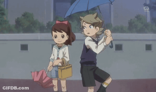 A Boy And A Girl Are Holding Umbrellas In Front Of A Tv Screen That Says Tbs GIF