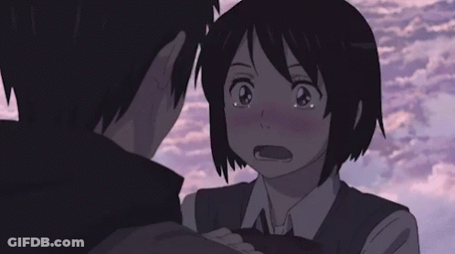 A Boy And A Girl Are Hugging Each Other And Looking At Each Other . GIF