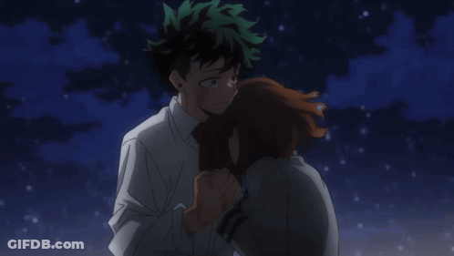 A Boy And A Girl Are Hugging Each Other In The Dark GIF