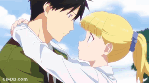 A Boy And A Girl Are Hugging Each Other With Their Eyes Closed GIF