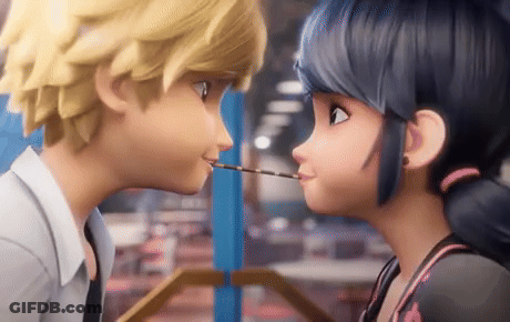 A Boy And A Girl Are Kissing Each Other With A Stick In Their Mouth . GIF