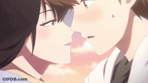 A Boy And A Girl Are Kissing In A Close Up Of Their Faces GIF