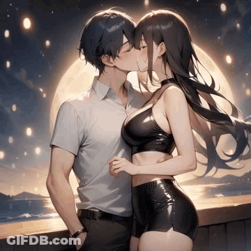 A Boy And A Girl Are Kissing In Front Of A Full Moon . GIF