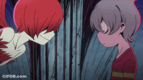 A Boy And A Girl Are Looking At Each Other GIF