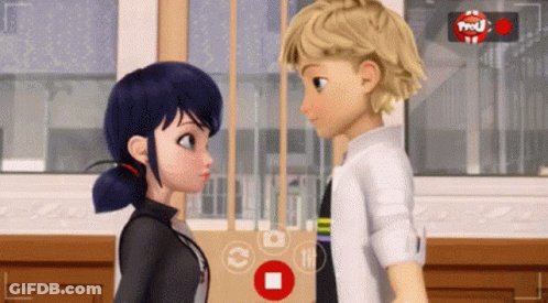 A Boy And A Girl Are Looking At Each Other In Front Of A Camera With A Red Button That Says ' Pause ' GIF