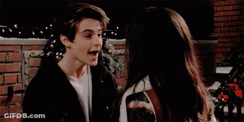A Boy And A Girl Are Looking Into Each Other 'S Eyes GIF