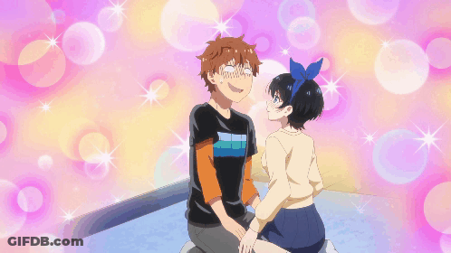 A Boy And A Girl Are Sitting Next To Each Other And The Girl Has A Blue Bow In Her Hair GIF