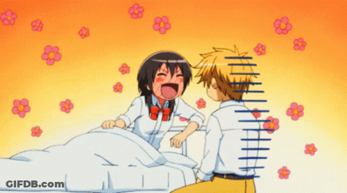 A Boy And A Girl Are Sitting Next To Each Other And The Girl Is Laughing GIF