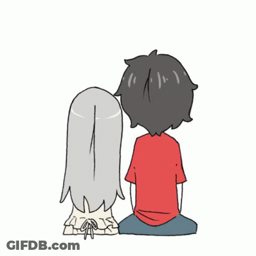 A Boy And A Girl Are Sitting Next To Each Other Looking At Something GIF
