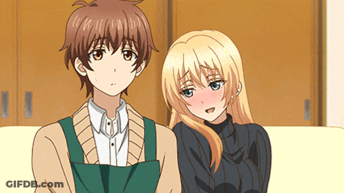 A Boy And A Girl Are Sitting On A Couch Together GIF