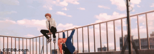 A Boy And A Girl Are Sitting On A Railing On Top Of A Building GIF