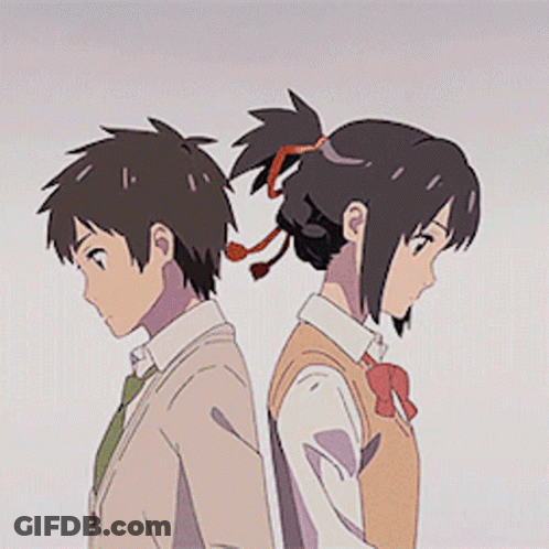 A Boy And A Girl Are Standing Back To Back With Their Heads Together . GIF