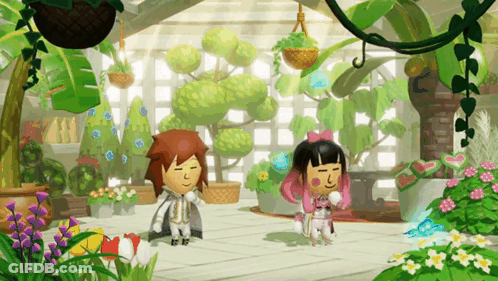 A Boy And A Girl Are Standing In A Garden With Plants And Flowers GIF