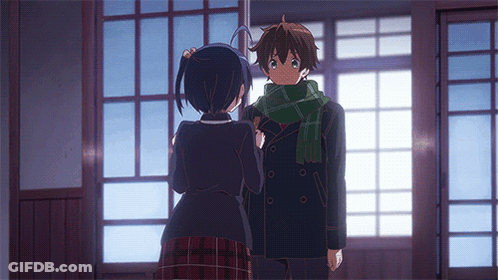 A Boy And A Girl Are Standing In Front Of A Window GIF