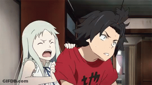 A Boy And A Girl Are Standing Next To Each Other And The Boy Is Wearing A Red Shirt With Chinese Characters On It GIF