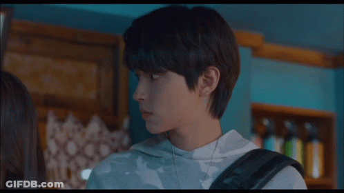 A Boy And A Girl Are Standing Next To Each Other And The Boy Is Wearing A Sweatshirt That Says Fm On It GIF