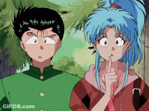 A Boy And A Girl Are Standing Next To Each Other And The Girl Has Her Finger On Her Mouth GIF