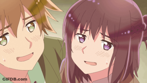 A Boy And A Girl Are Standing Next To Each Other GIF
