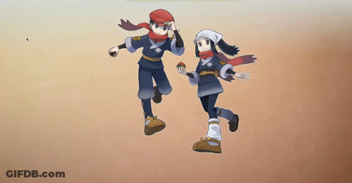 A Boy And A Girl Are Standing Next To Each Other Holding A Pokeball . GIF