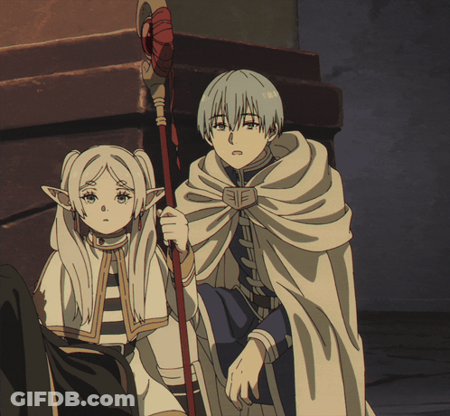 A Boy And A Girl Are Standing Next To Each Other In A Dark Room GIF
