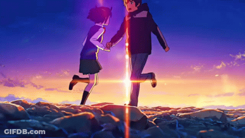 A Boy And A Girl Are Standing Next To Each Other In A Field Holding Hands GIF