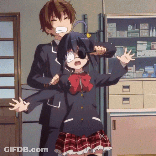 A Boy And A Girl Are Standing Next To Each Other In A Room With A Shelf Full Of Medicine GIF