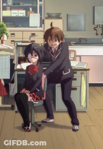 A Boy And A Girl Are Standing Next To Each Other In A Room With A Towel Hanging On The Wall GIF