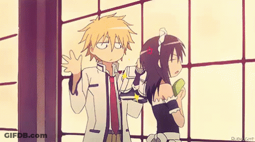 A Boy And A Girl Are Standing Next To Each Other In A Room . GIF