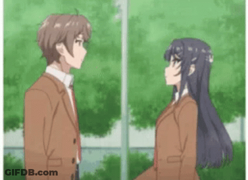 A Boy And A Girl Are Standing Next To Each Other In Front Of Trees . GIF
