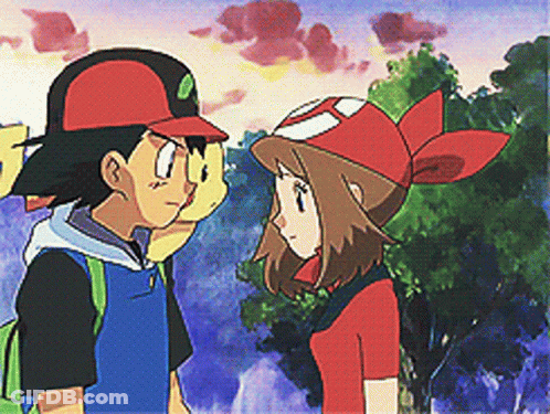 A Boy And A Girl Are Standing Next To Each Other Looking At Each Other GIF