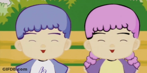 A Boy And A Girl Are Standing Next To Each Other Smiling GIF