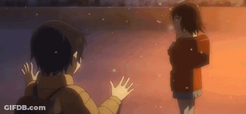 A Boy And A Girl Are Standing Next To Each Other Waving Their Hands In The Air . GIF