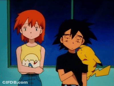 A Boy And A Girl Are Standing Next To Each Other With A Pikachu Between Them GIF