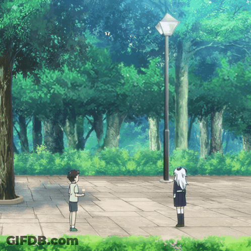 A Boy And A Girl Are Standing On A Sidewalk In The Woods GIF